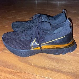 Nike React black and gold women’s size 10